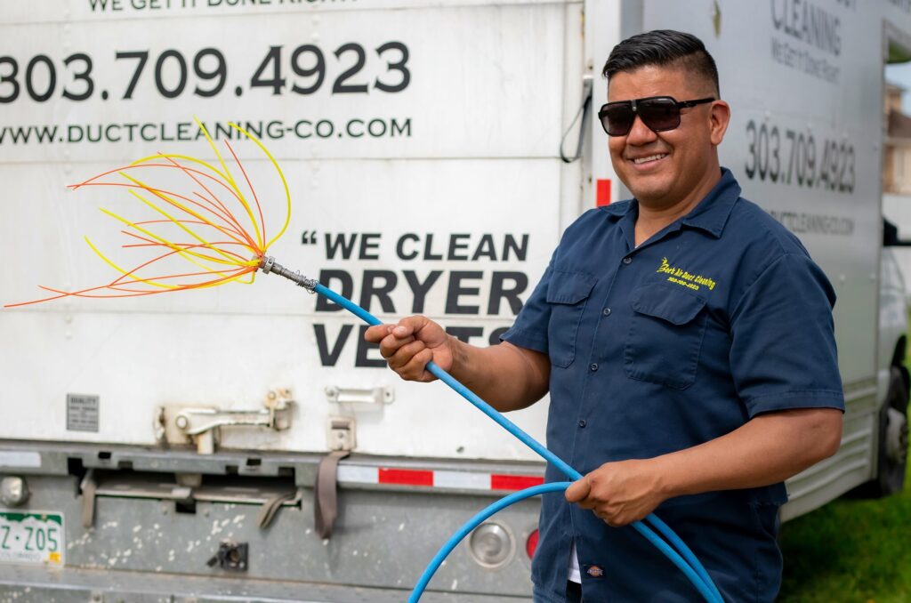 Technician holding equipment - Brighton Air Duct Cleaning Process